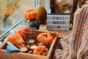 Autumn,Cozy,Mood,Composition,On,The,Windowsill.,Pumpkins,,Cones,,Candles